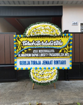 Papan Bunga Duka di Logandeng